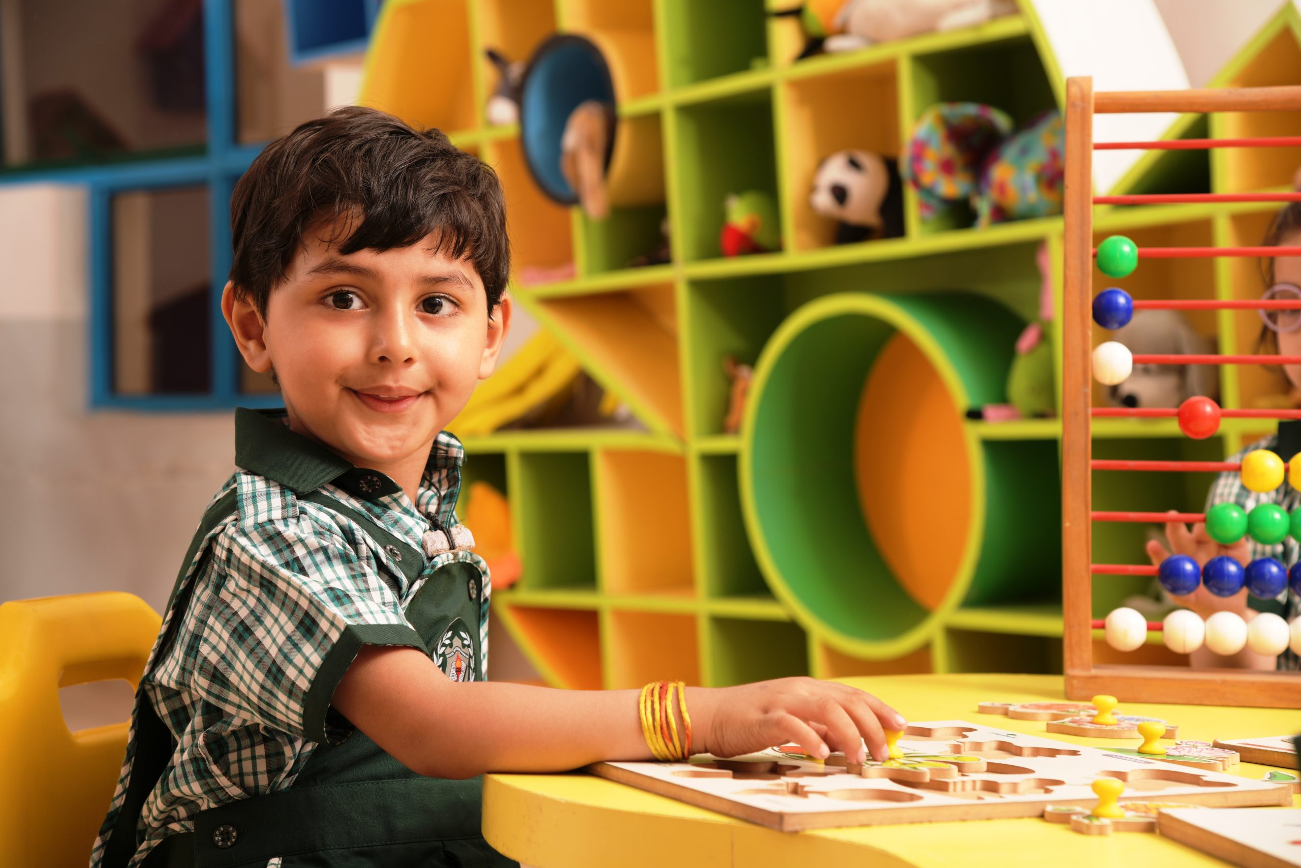 boy playing in best preschools in Noida extension