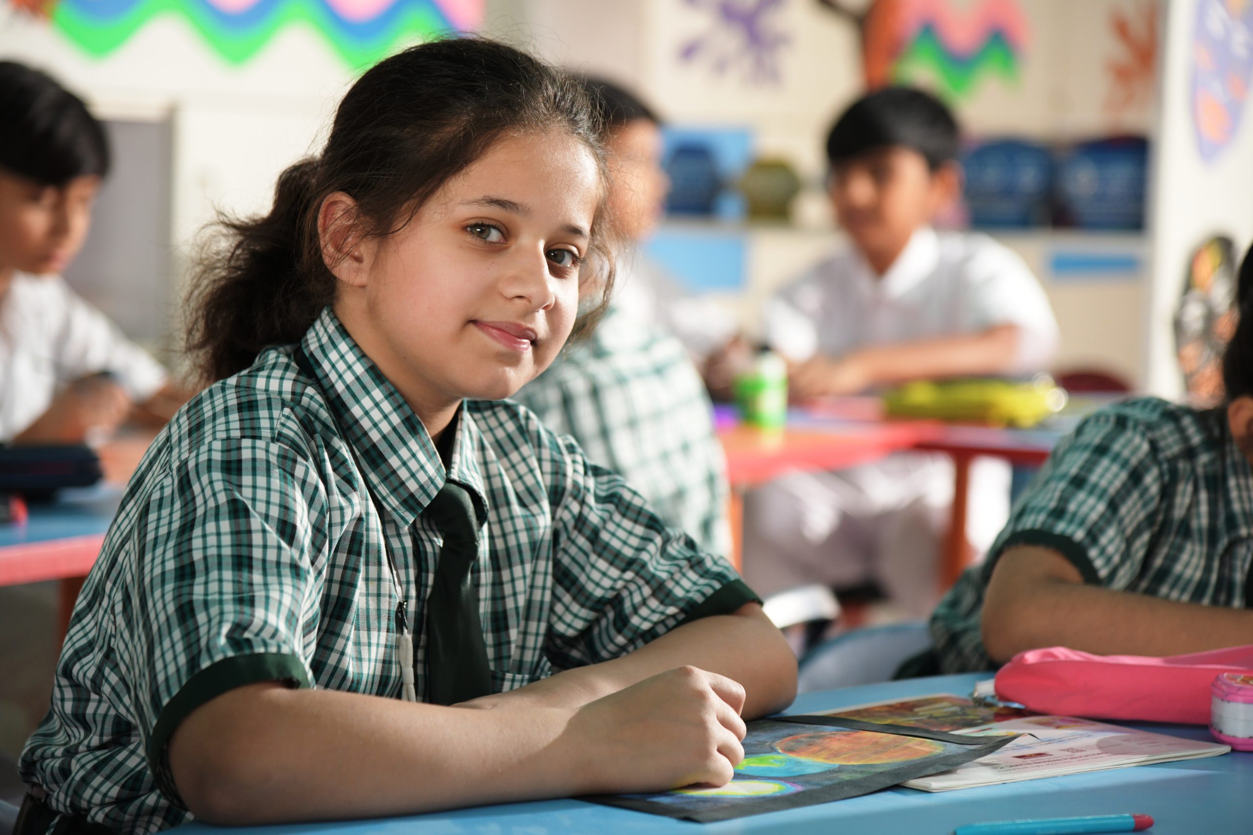 girl student studing in best schools near noida extension classroom